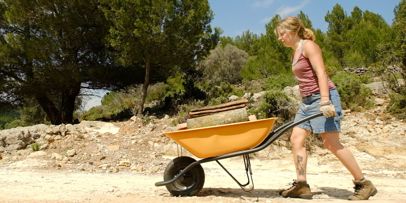 Pushing a wheelbarrow